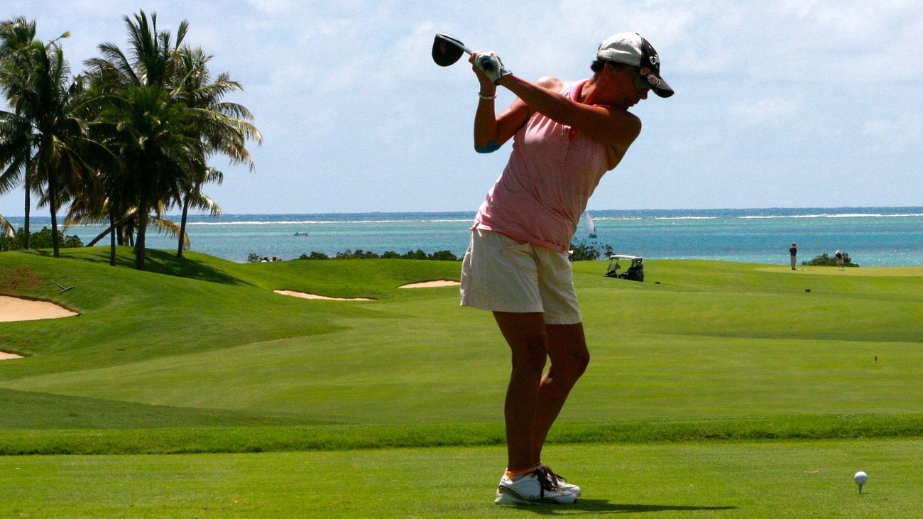 a woman playing golf
