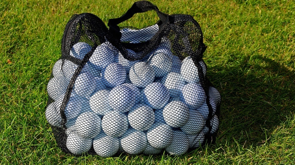 golf ball bag the featured image for how much does a golf ball weigh article.